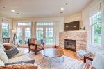 Aqua Essence has a cozy living room with flat screen TV and seasonal gas fireplace 